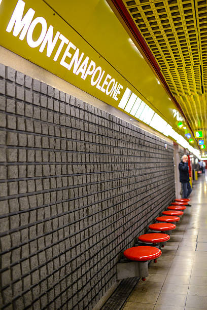 Milan, Italy - October 22, 2012: Montenapoleone Subway station, Milan, Italy. Man standing on platform. Via Montenapoleone is the well-know shopping street in Milan. 