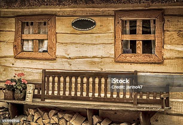 Bench In Front Of Cottage Stock Photo - Download Image Now - 2015, Architecture, Bench