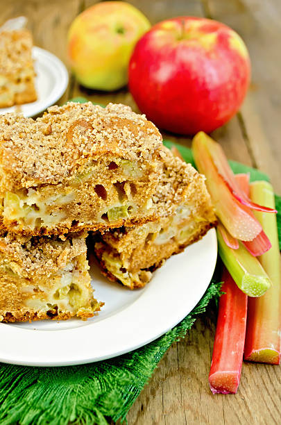 istock Pie rhubarb and apple on a wooden board 497997003