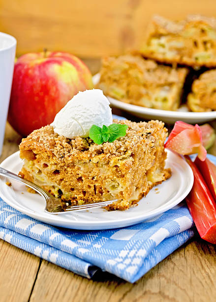 istock Pie with rhubarb  and ice cream on the board 497997791