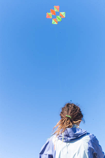 istock People in nature start flying kite 497998231