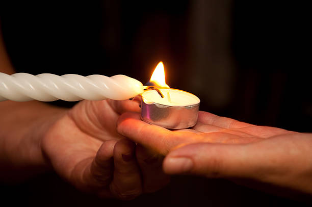 Hands with candles stock photo