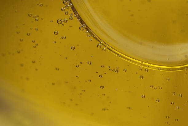 istock Air bubbles in glass on oil 498010559