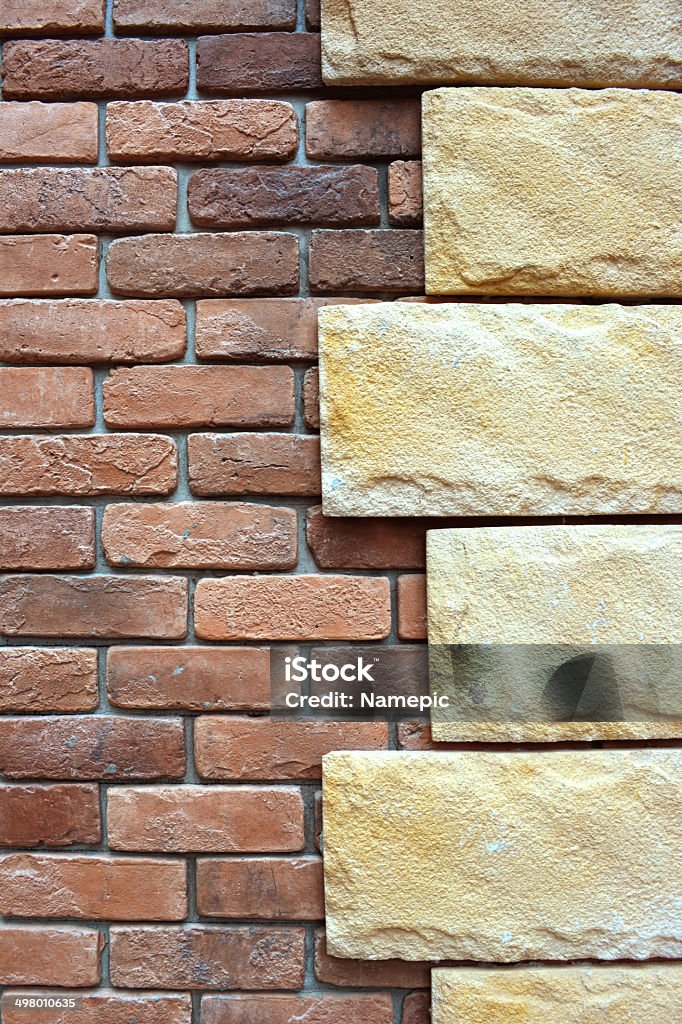 Stone on brick wall background. Detail stone on brick wall background. Advice Stock Photo