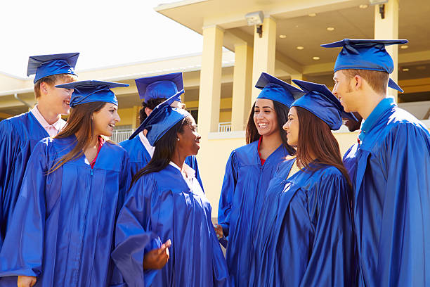 istock Group Of High School Students Celebrating Graduation 498010667