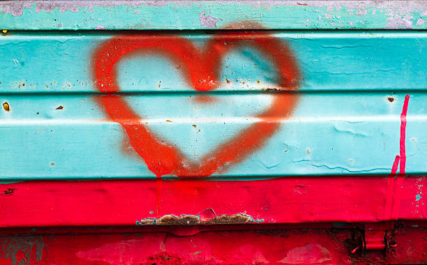 istock Big Red Heart Spray-Painted on Mottled Turquoise Background 498011505