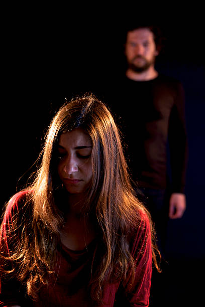 istock Sad woman oppressed by dark man 498012479
