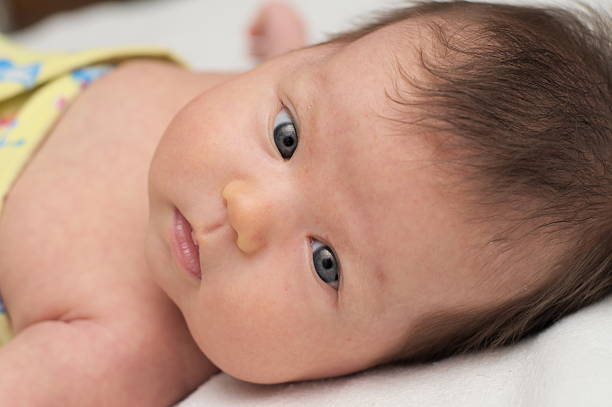 istock Newborn baby with gray eyes 498013619