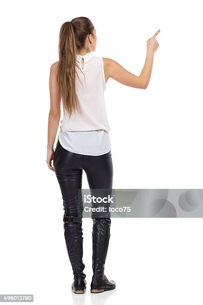 Rear View Of Pointing Woman Stock Photo - Download Image Now - Rear View, Women, People