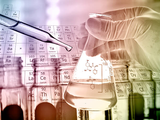 istock Flask in scientist hand and test tubes in rack 498014564