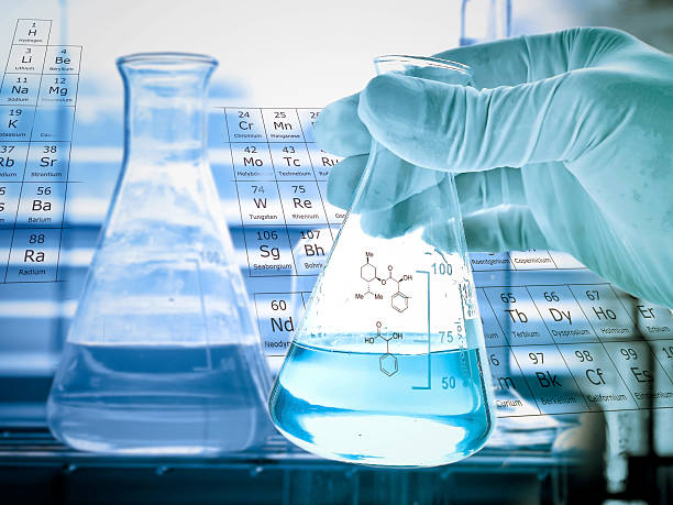 istock Flask in scientist hand and test tubes in rack 498014622
