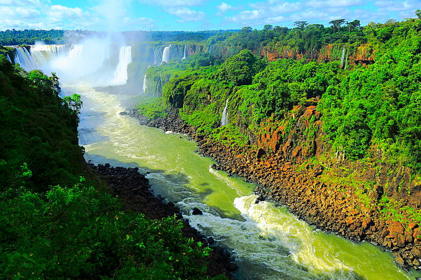istock Iguacu falls down stream river and green rainforest, Brazil 498015313