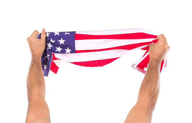 istock Hand holding American flag isolated on white background 498015885