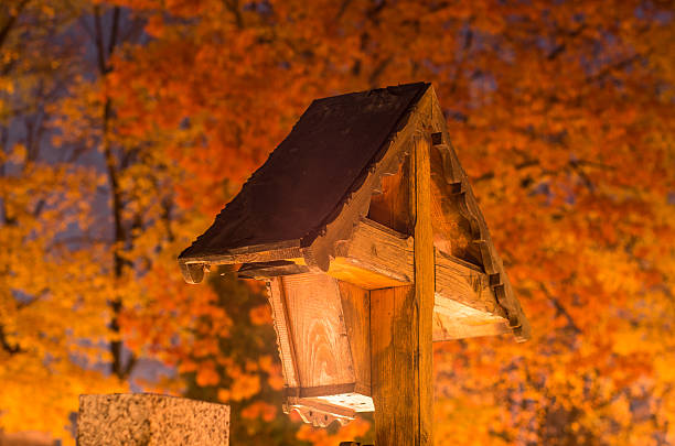 istock All saints day - cemetery cross with colorful trees 498016112