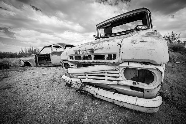 istock Scrap vintage car in the desert 498016249