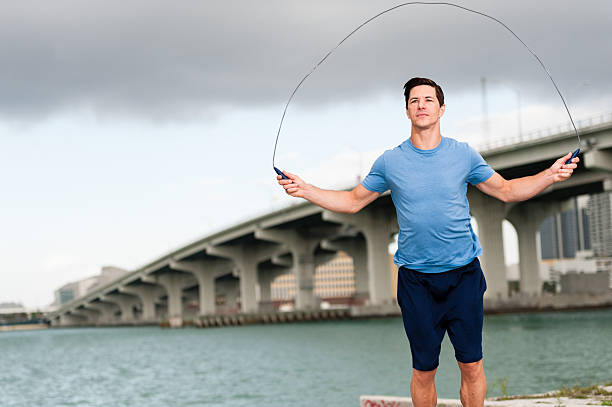 Young Man Yuppie Jumping Rope