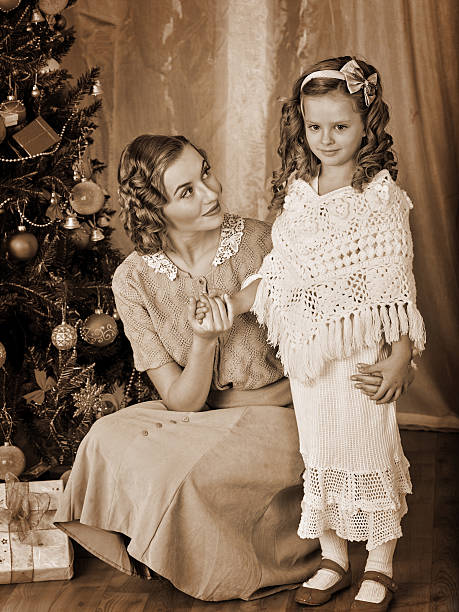 istock Kid with mother near Christmas tree 498016892