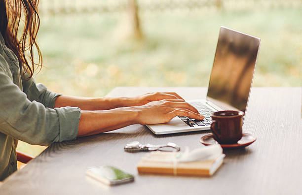 istock Female novelist writing on the laptop 498018420