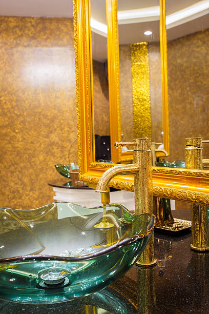 istock Water drop from gold colour faucet. 498018794