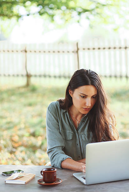 istock Female novelist writing on the laptop 498019960
