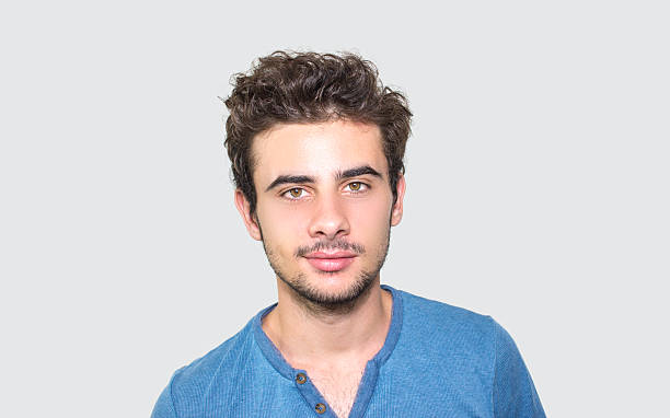 istock Portrait of young man against gray background 498020100