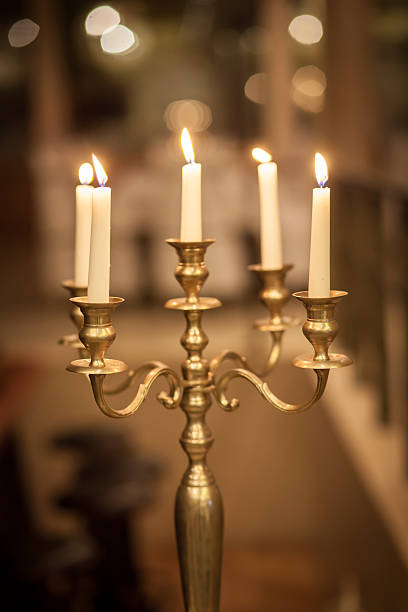 istock Vintage bronze candlestick with burning candles 498021100