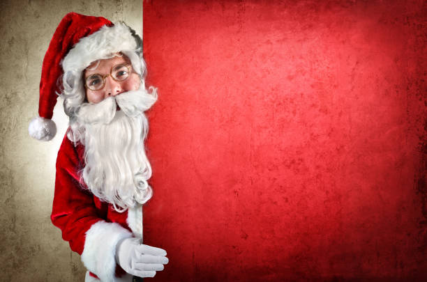 istock Santa Claus Showing Behind Of Red Billboard 498021194