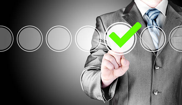 istock business man touching, pressing modern button with green ticking Check 498021324
