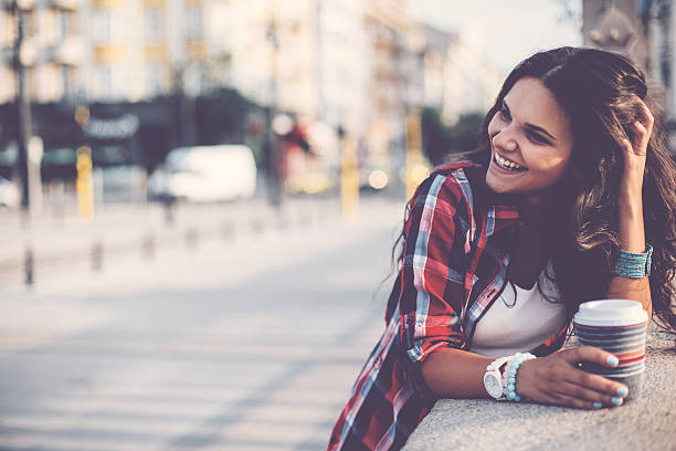 istock Young woman with coffee cup otudoors 498023146