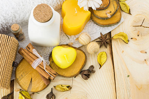 istock candle, cinnamon with towel on wood 498023264