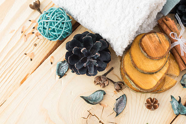 istock spa stuff, cinnamonand flower with towel on wood 498023296