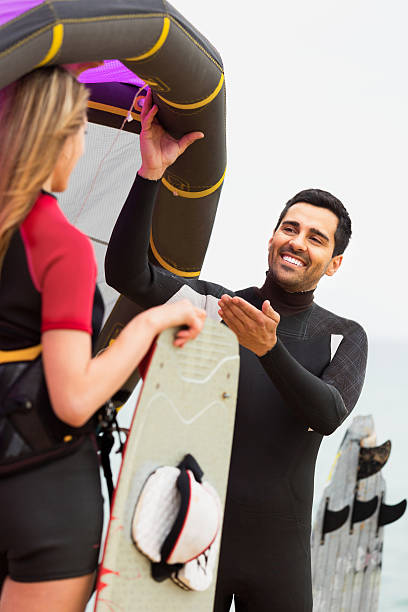istock Happy couple with kiteboard on on summer day 498026136