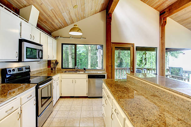 istock Kitchen room in log cabin house with walkout deck 498026855