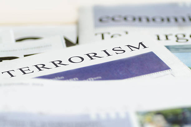 Terrorism Daily news newspaper headline reading terrorism concept. assassination photos stock pictures, royalty-free photos & images