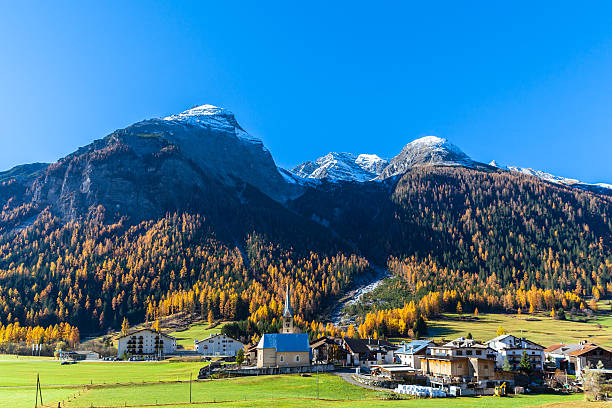 Beautiful view of Bergun in Autumn Beautiful view of the small town BergÃ¼n and the alps including Piz Ela from the sightseeing train Bernina Express in golden autumn with corlorful trees, Canton of Grisons, Switzerland graubunden canton stock pictures, royalty-free photos & images