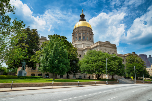 Georgia state capitol building in Atlanta under cloudy blue sky