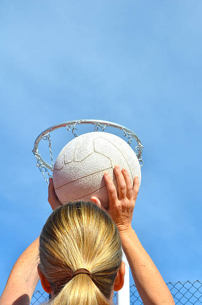 istock Girl Shooting Netball 498030569