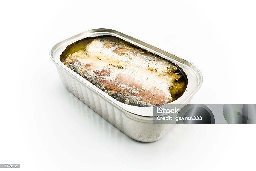 Sardines in opened tin can Sardines in opened tin can isolated on white Aluminum Stock Photo