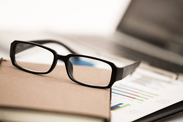 istock Businessman analyzing investment charts with laptop 498031471