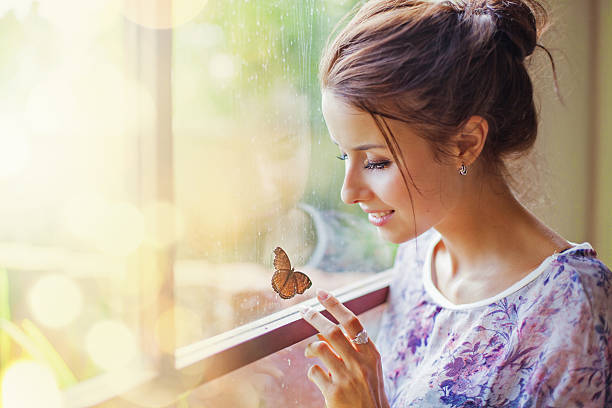 Beautiful woman with butterfly