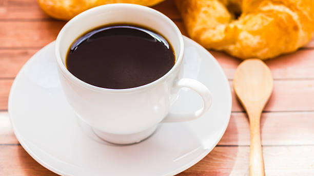 istock Bagels with sesame seeds and black coffee. 498046049