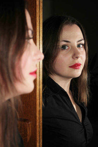 istock Woman posing in front of mirror 498046759