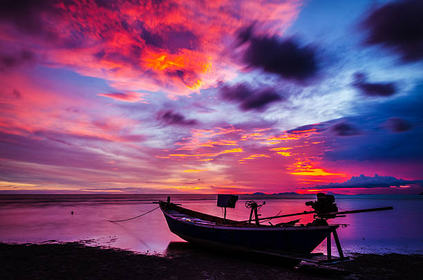 istock Fishing boats and sunset 498048217