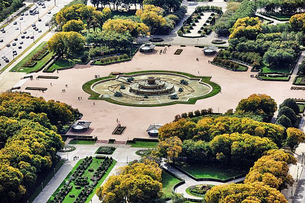 Buckingham Fountain in Grant Park, Chicago. Aerial view. Buckingham Fountain in Grant Park, Chicago. Autumn trees.  Empty fountain. Distant people. grant park stock pictures, royalty-free photos & images