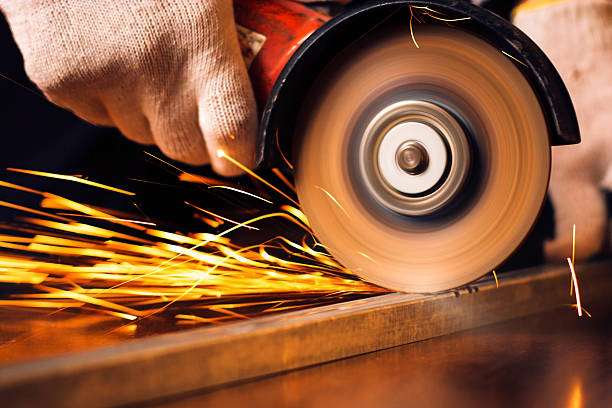 istock Red hot sparks at grinding steel material 498049129
