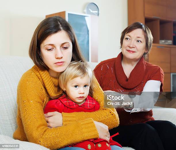 Conflict Between Sad Young Woman And Her Mature Mother Stock Photo - Download Image Now