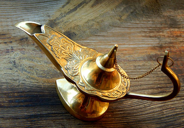 istock Magical genie lamp isolated on a wooden background 498050779