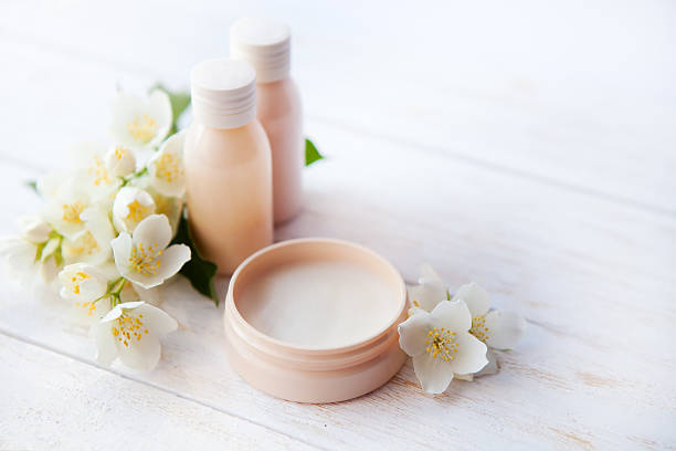 Spa setting with beauty cream and white  jasmine flower Spa setting with beauty cream and white  flower jasmine photos stock pictures, royalty-free photos & images