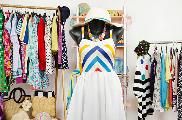 istock Wardrobe with summer clothes and a beach outfit on mannequin. 498051981