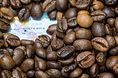Map of Costa Rica under a background of coffee beans